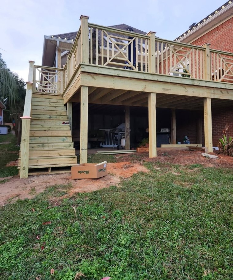 Elevated deck with stairs and patterned railing